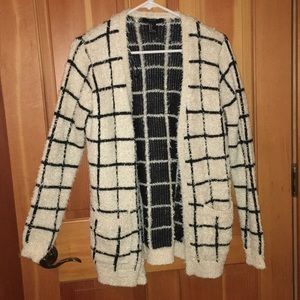 Black and cream colored cardigan